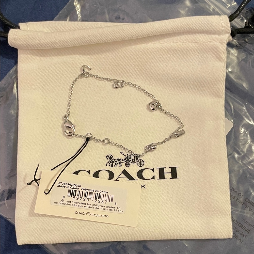 Coach Silver Charm Bracelet with Delicate Accents